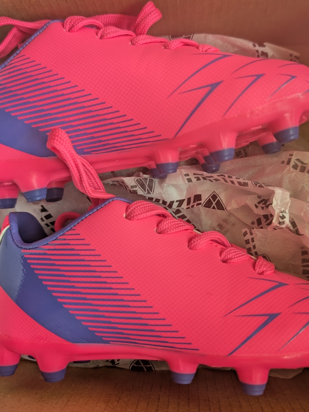 Bright Pink Youth Soccer Cleats with Purple Accents